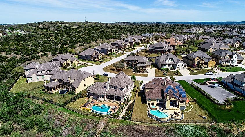 Aerial Drone View of Suburban Houses and Modern Development Layout in Dripping Springs, Texas, USA.
