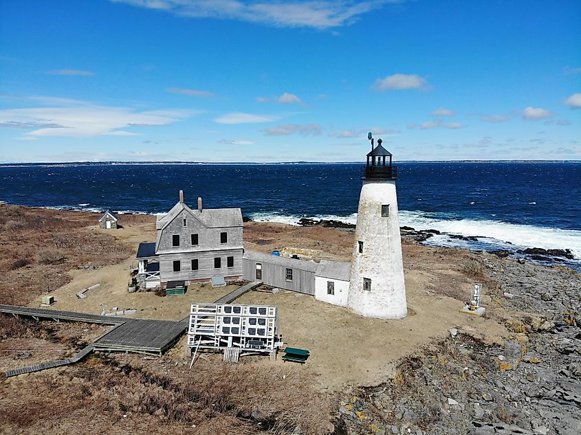 Aerial drone views of Wood Island Lighthouse on Wood Island in Biddeford, Maine