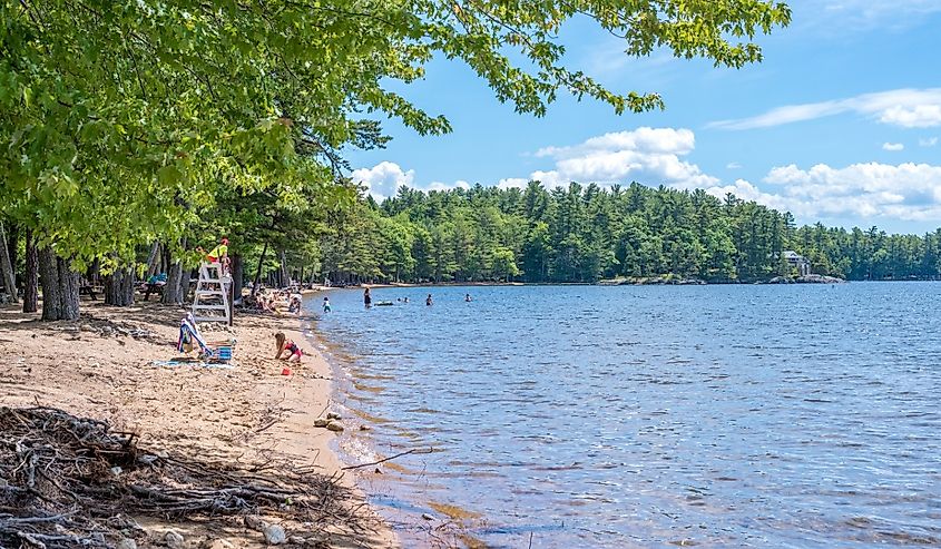 People on the beach at Sebago Lake State Park, Maine