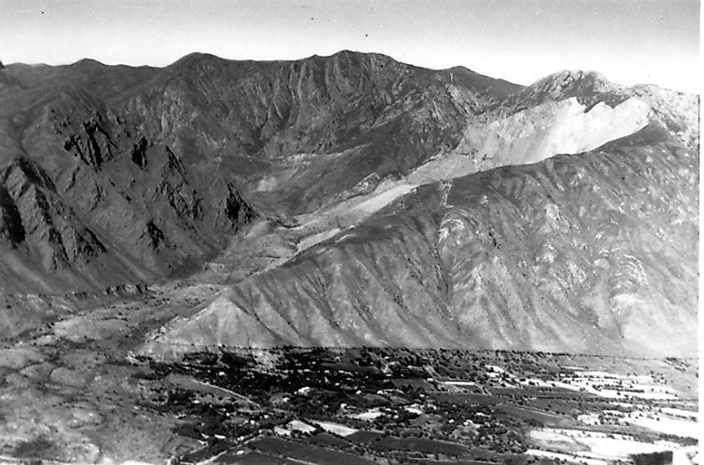 View of the Khait landslide showing the scar on Chokrak mountain and the landslide that overwhelmed the village of Khait