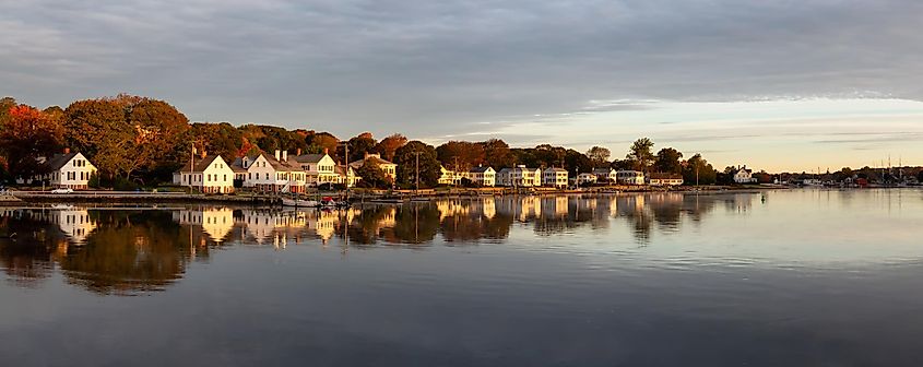 Panoramic view of residential homes by the Mystic River during a vibrant sunrise in Mystic, Stonington, Connecticut, USA.
