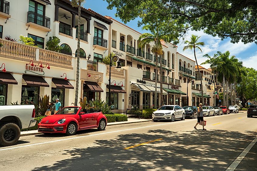 Tourists walking and shopping along the restaurants and luxury stores of 5th Avenue in downtown Naples, Florida.
