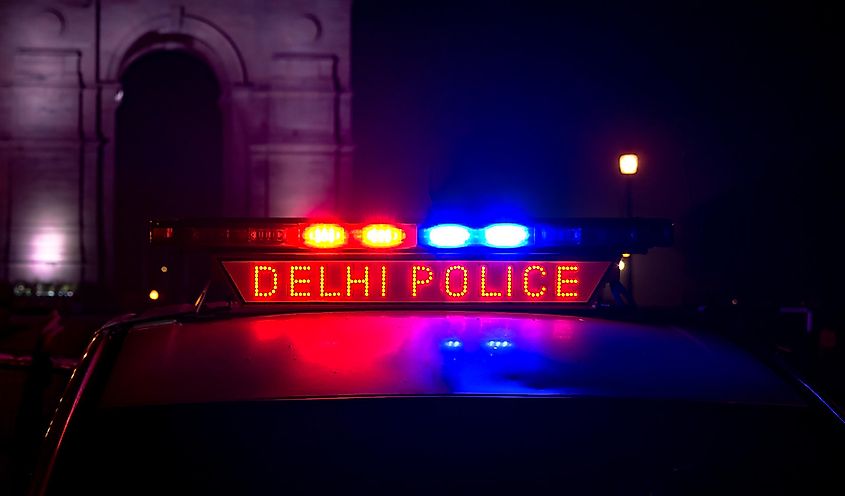 Delhi Police PCR van with siren lights, patrolling near India Gate area of Connaught Place during midnight hours to keep the city safe from any crime or criminal activity.