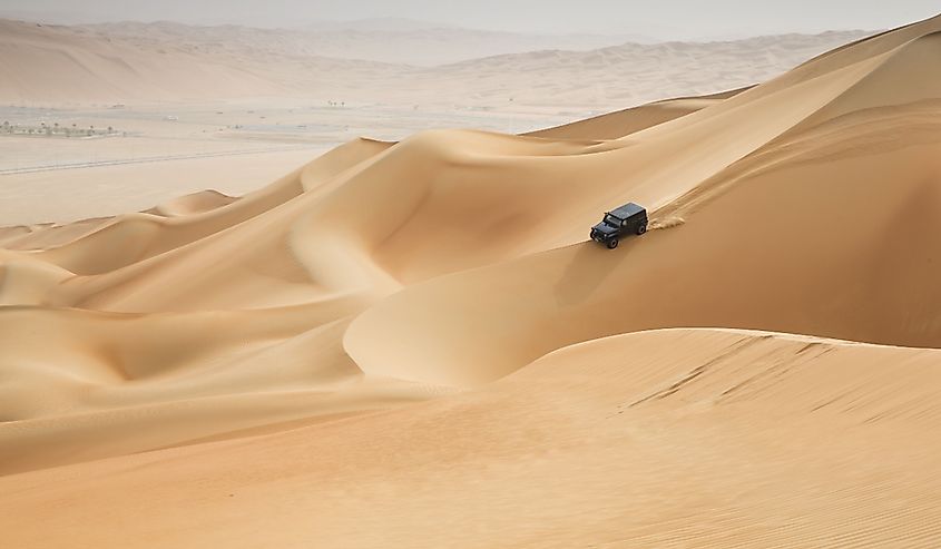 Car driving in Rub al Khali Desert at the Empty Quarter