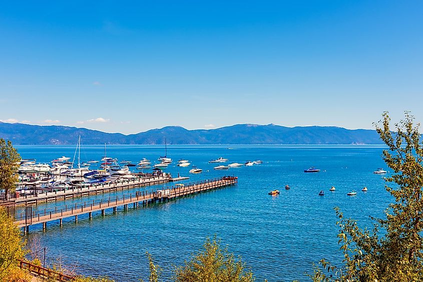 View of Lake Tahoe and the Sierra Nevada Mountains from the marina in Tahoe City, California.