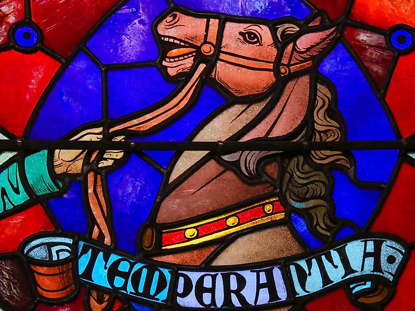 Stained Glass window representing the cardinal virtue Temperance, symbolized by horse, in the Cathedral of Saint Rumbold in Mechelen, Belgium.