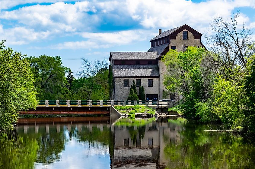 A stone mill surrounded by greenery in Cedarburg, Wisconsin.