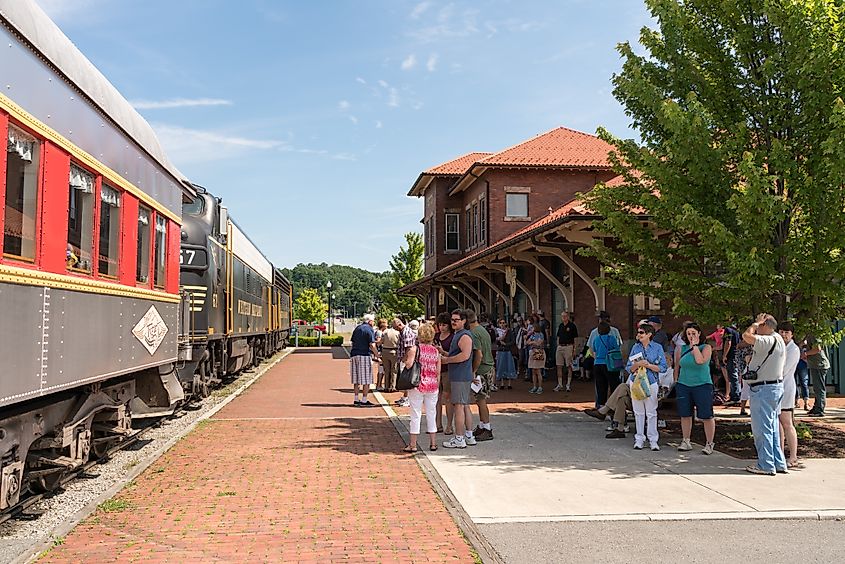 Tourists ready to board the Tygart Flyer for a trip into the mountains of West Virginia by the Durbin and Greenbrier Valley Railroad in Elkins, West Virginia, USA.