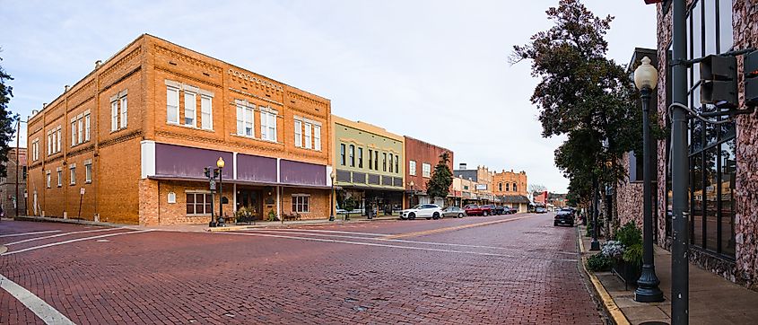 owntown Nacogdoches, brick-covered streets, and old historic buildings.