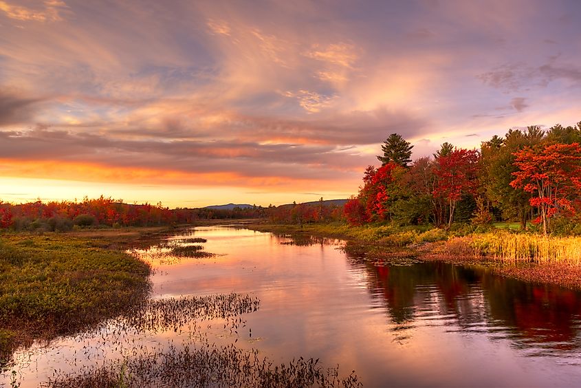 Sunset at Hamlet of Lake Pleasant in fall, Adirondack, NY.