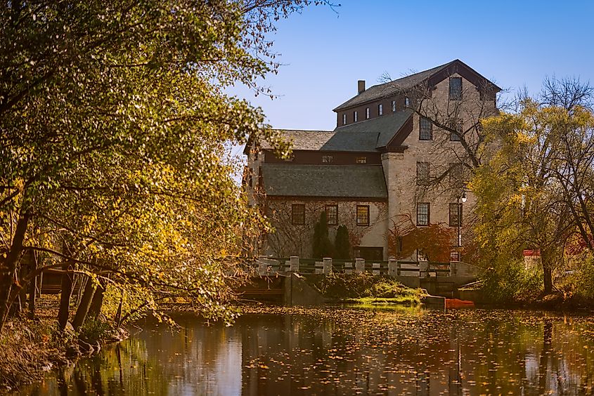 The old mill in Cedarburg, Wisconsin, is no longer a working mill but still serves as a venue for various activities and shops, preserving its historical significance.