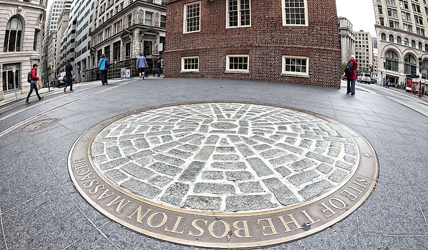 The Site of The Boston Massacre in front of the Old Massachusetts State House with locals and tourists passing by on October 16, 2013 in Boston