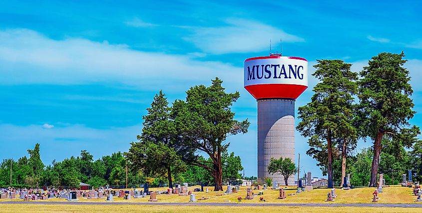 The Mustang watertower behind a cemetery in Mustang, Oklahoma.