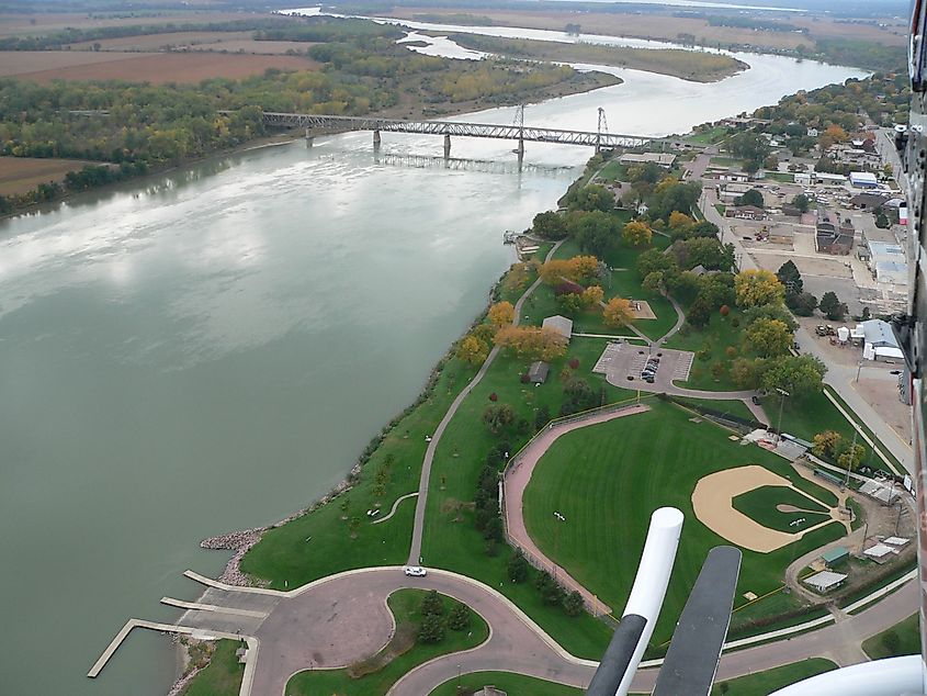 Yankton (right) along the Missouri River with the Meridian Bridge connecting Nebraska, looking west