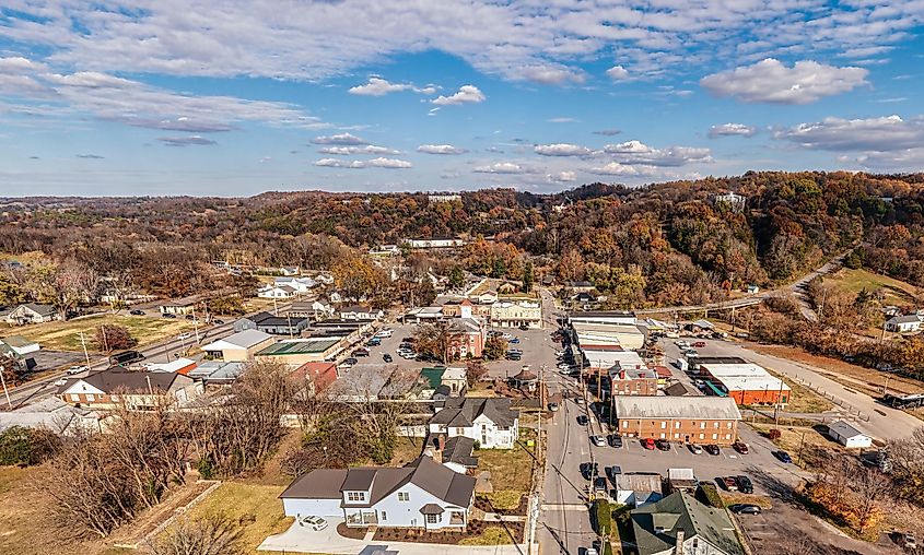 Aerial panorama view of a small southern town square with whiskey barrel houses on the hill and autumn colors in Lynchburg