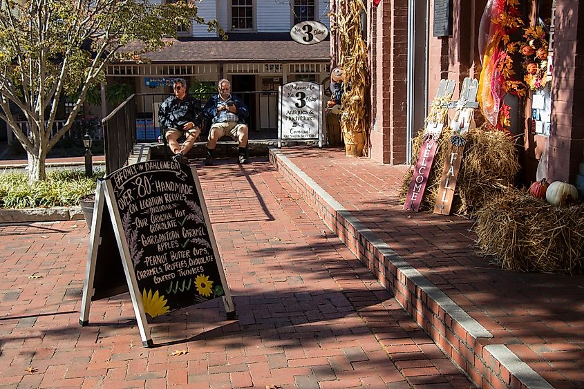 Seasonal harvest-themed outdoor decorations create an inviting entrance to a gift shop in the historic downtown district of Dahlonega, Georgia.