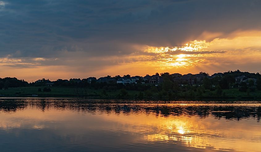 Sunrise on Walnut Creek Lake in Papillon, Nebraska. Image credit DV Captures via Shutterstock.