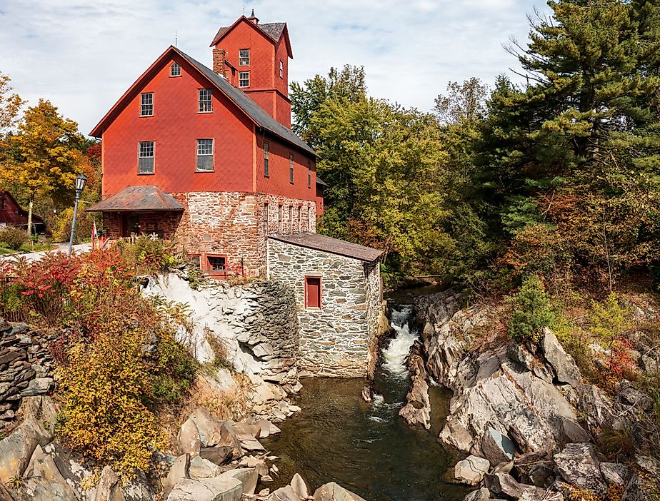 Old Red Mill by the creek in Jericho, Vermont during the fall.