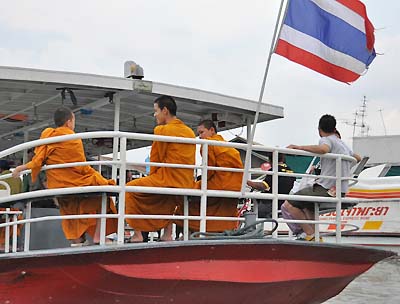 monks on a boat