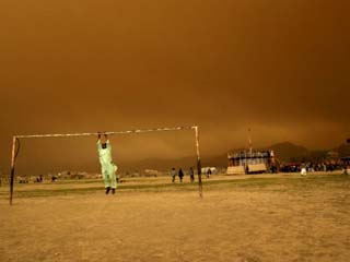 Playing a Friendly Soccer Match in a Park During a Sandstorm in Kabul, Afghanistan