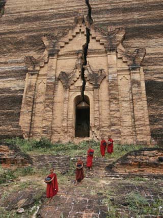 Young Buddhist Monks near a Ruined Temple in Laos