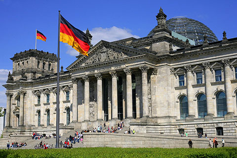 The German flag flying outside the Reichstag, the home of German Goverment