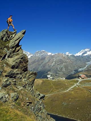 Hiker High on Trail Above Lake at Schwarzee Paradise, Zermatt, Valais, Switzerland