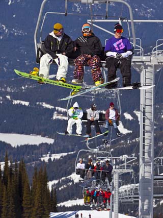 Chairlift Carrying Skiers and Snowboarders, Whistler Blackcomb Ski Resort, British Columbia, Canada
