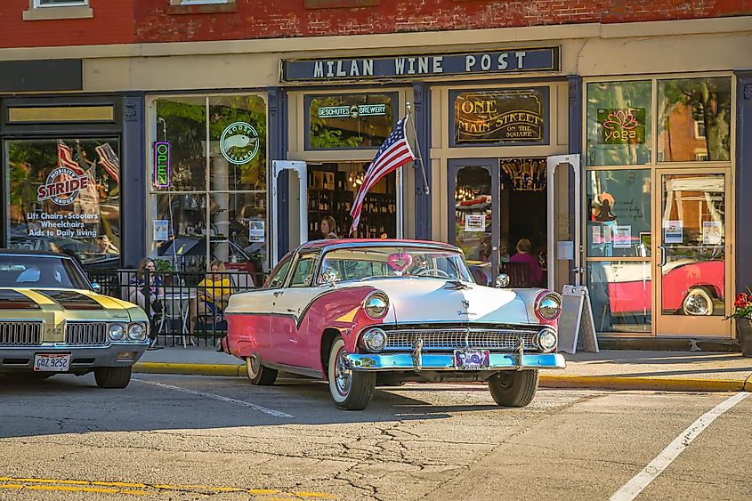 Milan, Ohio: A beautiful pink Ford is parked in front of local shops on a summer cruise night.