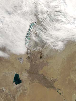 Distinctive Lines of Clouds Stretch Out from the Shore of the Aral Sea