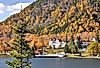 Mountainside of colorful fall foliage, Lake Gloriette, and historic Balsams Grand Resort Hotel in remote Dixville Notch, New Hampshire