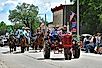 Elderly local farmer drives his 1939 Farmall model H tractor leading a group of Cowboys and Cowgirls in the annual Flint Hills Rodeo parade USA