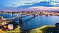 Ben Franklin Bridge and Philadelphia skyline at dusk viewed from above Cooper's Poynt Park, in Camden.