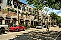 Tourists walking and shopping along the restaurants and luxury stores of 5th Avenue in downtown Naples, Florida, via AevanStock / Shutterstock.com