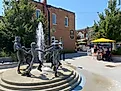 The sculpture fountain of Creemore’s Village Green courtyard flows into the sidewalk patio of the Bank Café. Photo Credit: Andrew Douglas