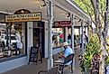 People walking around downtown Fredericksburg, Texas along the main street, via Peter Blottman Photography / iStock.com