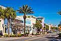Colorful storefronts in downtown Panama City Beach, Florida, USA on a clear day.