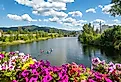 A group of kayakers enjoy a beautiful summer day on Sand Creek River and Lake Pend Oreille in the downtown area of Sandpoint, Idaho.