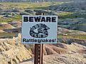 Sign warning about the presence of snakes in the US