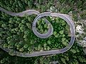 Aerial view of Norbeck Scenic Byway winding through forested hills and rugged terrain in the Black Hills of South Dakota