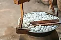 The process of producing silk by hand from silkworm cocoons.