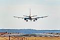 A Delta Air Lines aircraft approaches the runway for landing at Reagan National Airport on a clear day. Image credit: Eli Wilson / Shutterstock.com