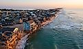 Aerial view of homes right on the shoreline in Buxton, North Carolina.