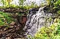 The mammoth waterfall is set amidst dense foliage and river rock at Cuyahoga Valley National Park in Ohio.