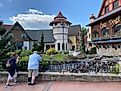 A couple of fellow tourists admiring the manicured naturescape and Bavarian architecture within Frankenmuth’s River Place Shops. Photo credit: Andrew Douglas