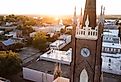 Sunset light shines on a historic church and landscape of downtown Natchez, Mississippi. Image credit Matt Gush via Shutterstock