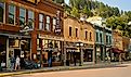 Historic saloons, bars, and shops bring visitors to Main St. in this Black Hills gold rush town of Deadwood, South Dakota, USA. Editorial credit: Kenneth Sponsler / Shutterstock.com