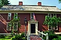 The Colonial-era 1716 Wayside Inn, immortalised by Henry Wadsworth Longfellow in "Tales of the Wayside Inn", still provides lodging and fine dining to travelers as the oldest hotel still running in America. Editorial credit: LEE SNIDER PHOTO IMAGES / Shut