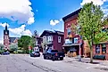 Buildings in New Glarus, Wisconsin, showcasing charming Swiss-inspired architecture with chalet-style facades. Editorial credit: Erwin Widmer / Shutterstock.com