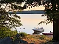 Two small boats at sunset at Watchaug Pond in Burlingame State Park, Charlestown Rhode Island 